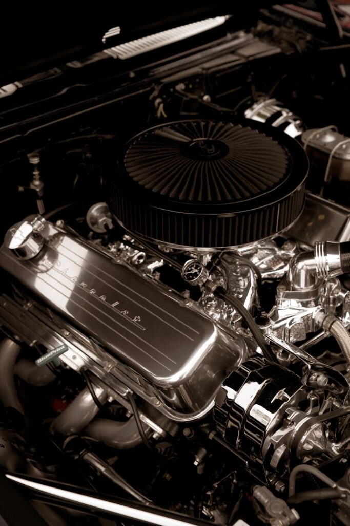 Privacy Policy Detailed view of a shiny chrome car engine, showcasing power and precision.