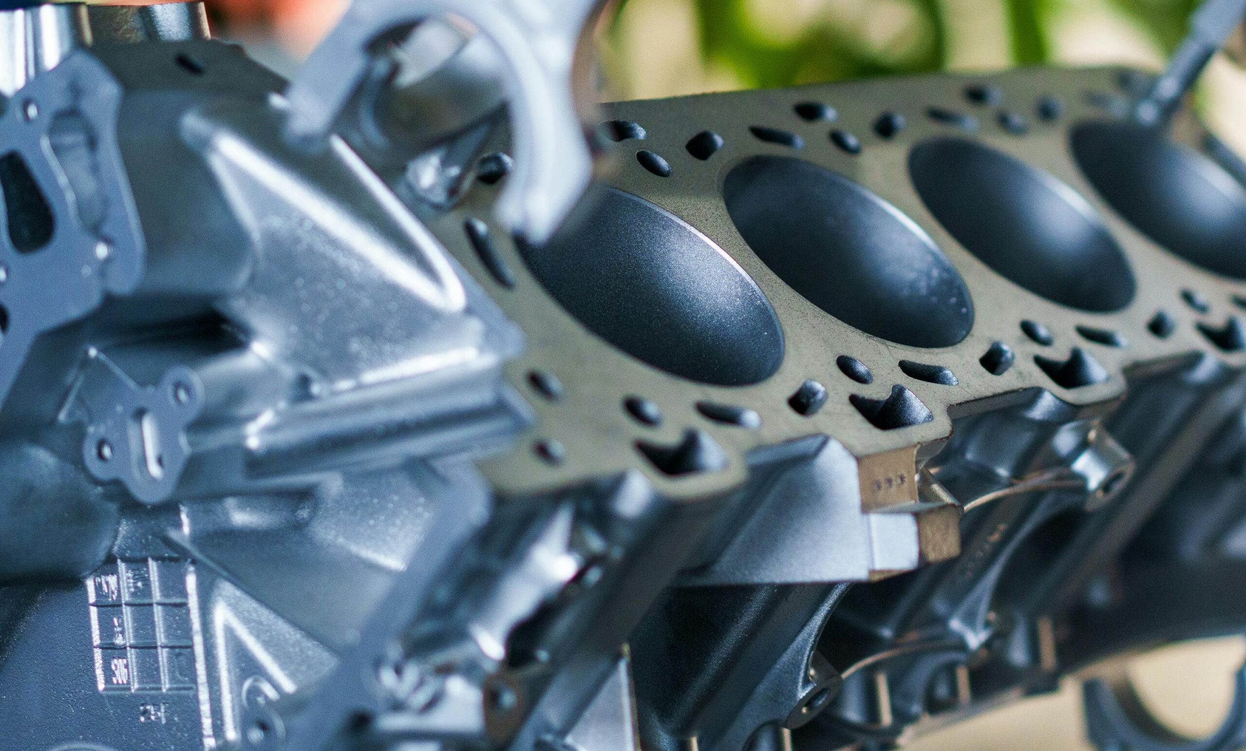 Detailed close-up of a metallic engine block showcasing industrial machinery elements.